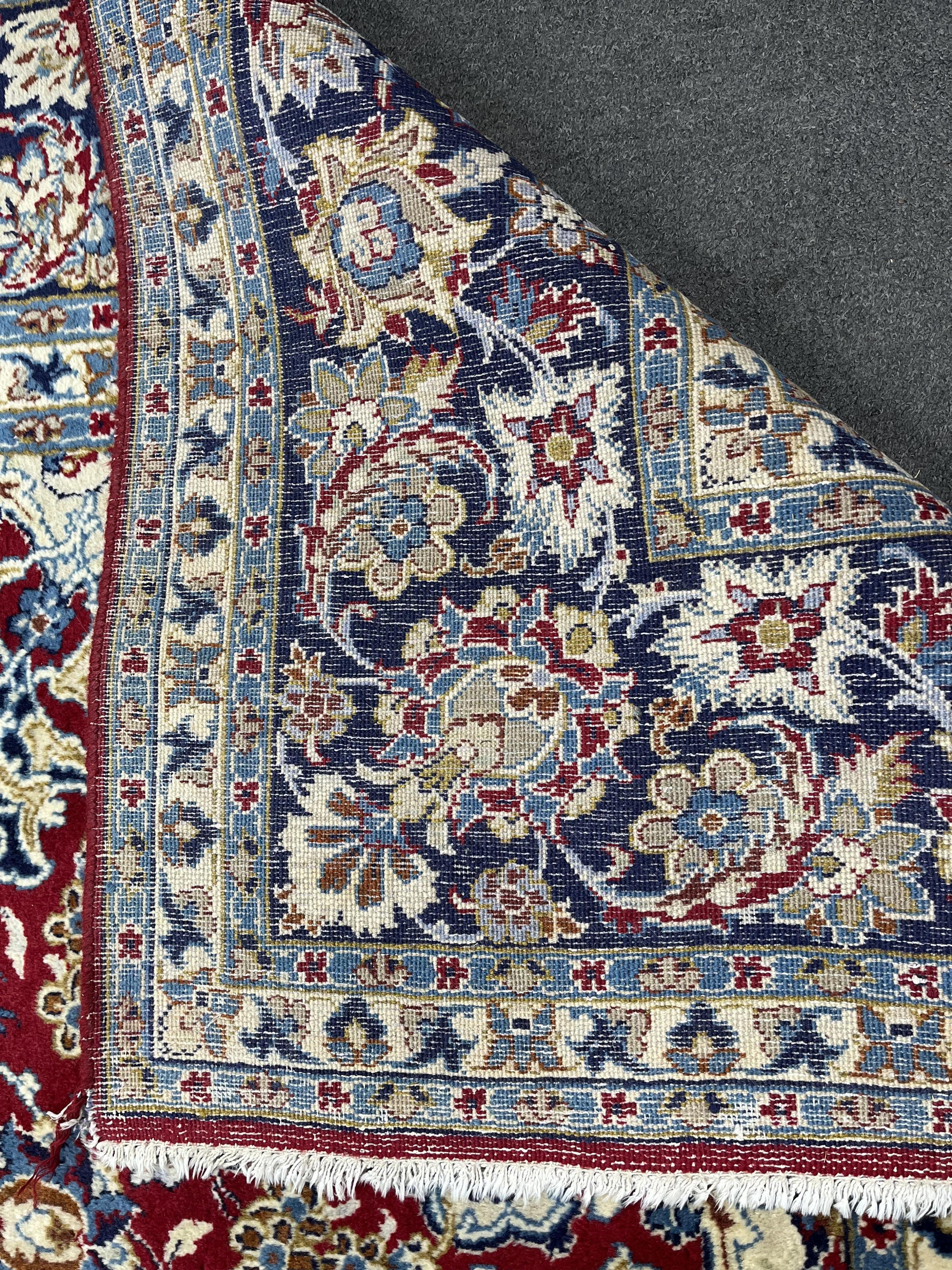 A Persian burgundy ground carpet, 410 x 282cm. Condition - good